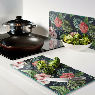 Glass kitchen board Tropical flowers with leaves