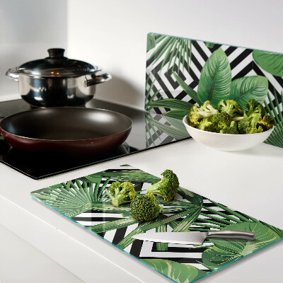 Glass kitchen board Tropical leaves on stripes