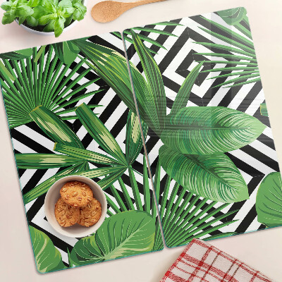 Glass kitchen board Tropical leaves on stripes
