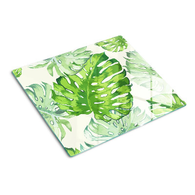 Glass kitchen board Monstera leaves on a light background