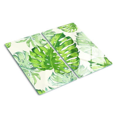 Glass kitchen board Monstera leaves on a light background