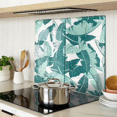 Glass kitchen board Tropical leaves in shades of green