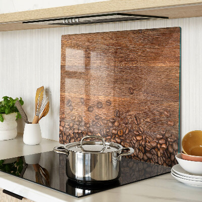 Glass chopping board Coffee beans on wooden background