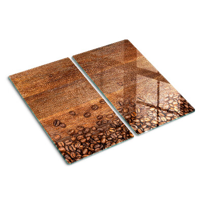 Glass chopping board Coffee beans on wooden background