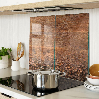 Glass chopping board Coffee beans on wooden background