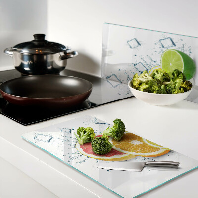 Glass kitchen board Citrus fruits in colorful slices