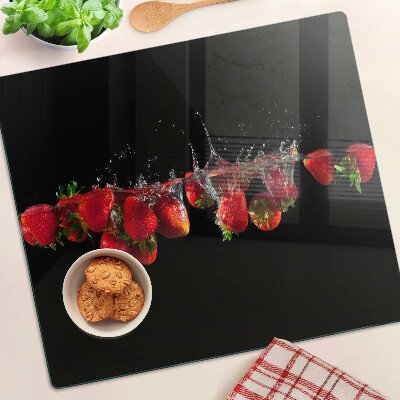 Glass chopping board Strawberries in water