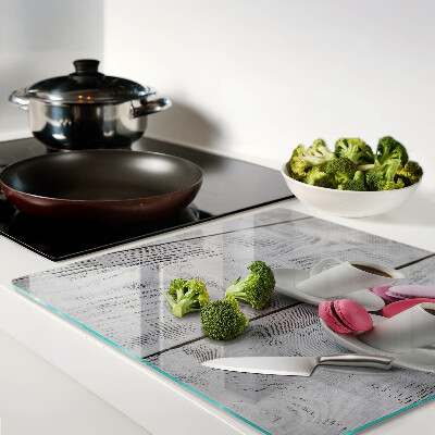 Glass chopping board Coffee and macaroons on a wooden background