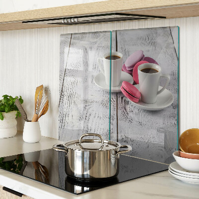 Glass chopping board Coffee and macaroons on a wooden background