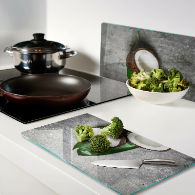 Glass kitchen board Coconut on concrete background