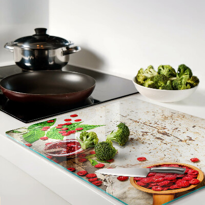 Glass kitchen board Raspberries and leaves