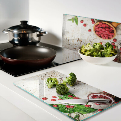 Glass kitchen board Raspberries and leaves