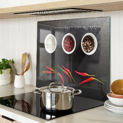 Glass chopping board Spices and red peppers
