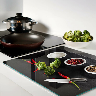 Glass chopping board Spices and red peppers