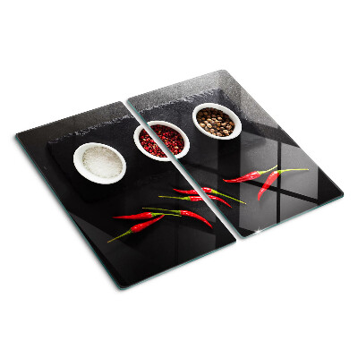 Glass chopping board Spices and red peppers