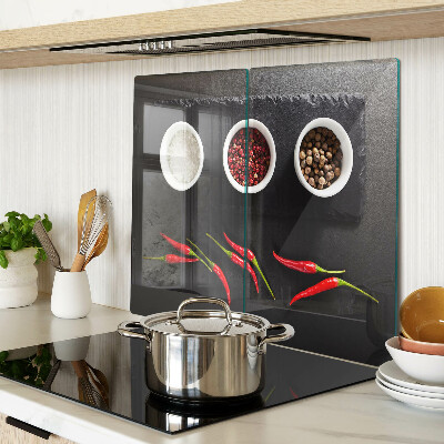 Glass chopping board Spices and red peppers