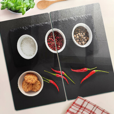 Glass chopping board Spices and red peppers