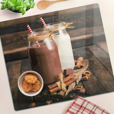 Glass kitchen board Jars with drinks on a wooden background