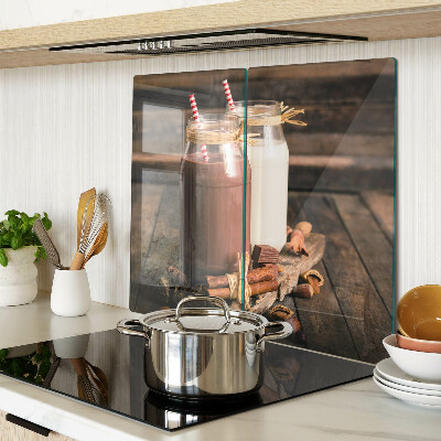 Glass kitchen board Jars with drinks on a wooden background
