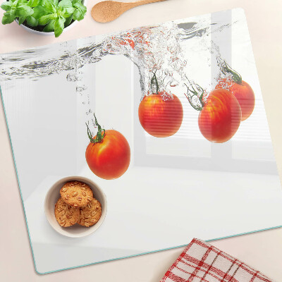 Glass kitchen board Tomatoes in water