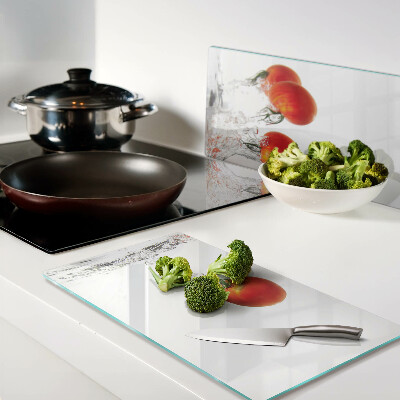 Glass kitchen board Tomatoes in water