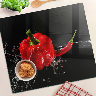 Glass kitchen board Red pepper in water