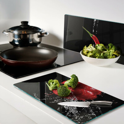 Glass kitchen board Red pepper in water