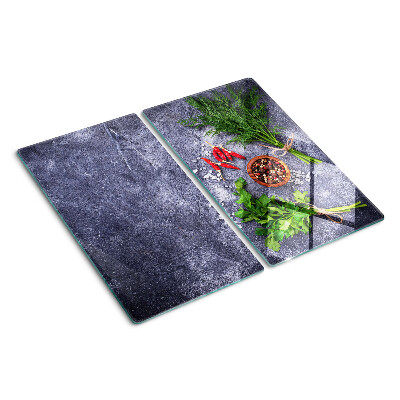 Glass kitchen board Herbs and spices on a stone background