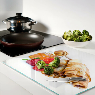 Glass kitchen board Pancakes with honey and strawberries