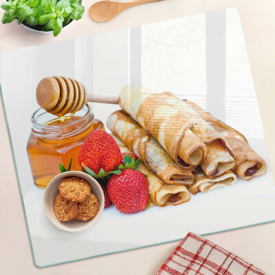 Glass kitchen board Pancakes with honey and strawberries