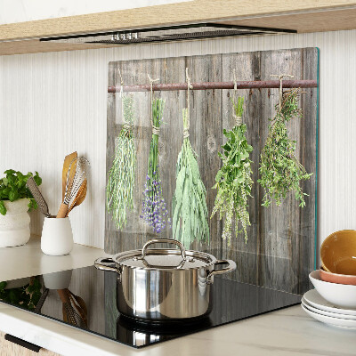 Glass kitchen board Herbs on a wooden background