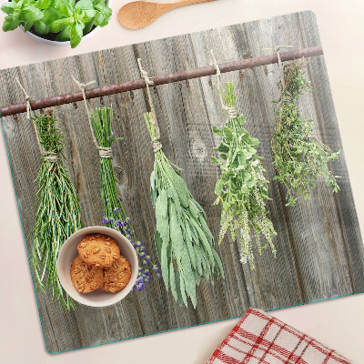 Glass kitchen board Herbs on a wooden background