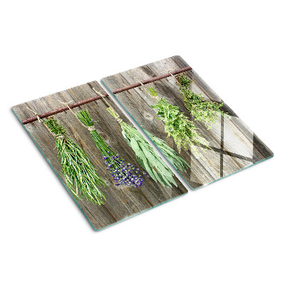 Glass kitchen board Herbs on a wooden background