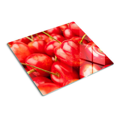 Glass kitchen board Cherries on a red background