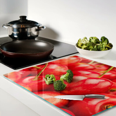 Glass kitchen board Cherries on a red background