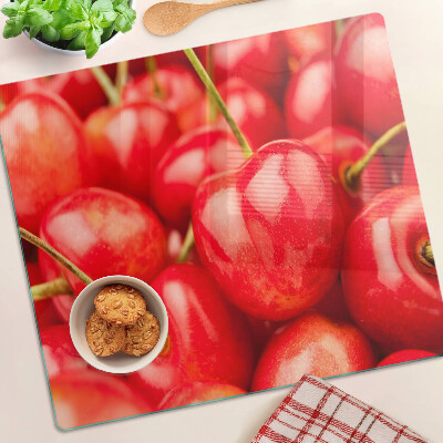 Glass kitchen board Cherries on a red background