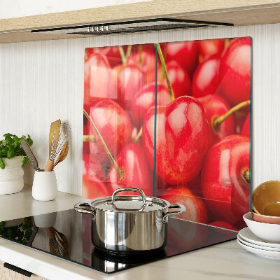 Glass kitchen board Cherries on a red background
