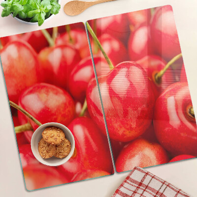 Glass kitchen board Cherries on a red background