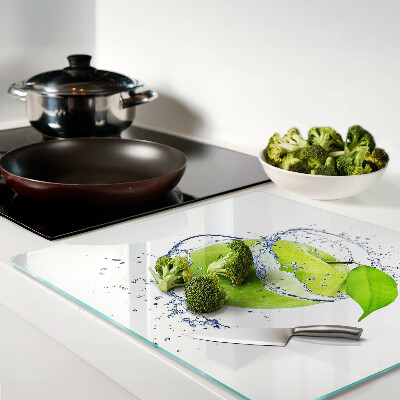Glass chopping board Apple in water