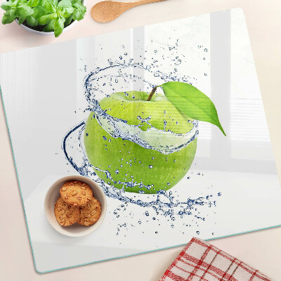 Glass chopping board Apple in water