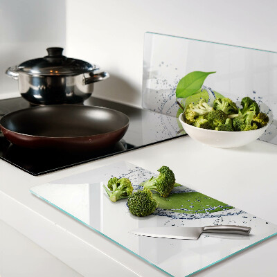 Glass chopping board Apple in water