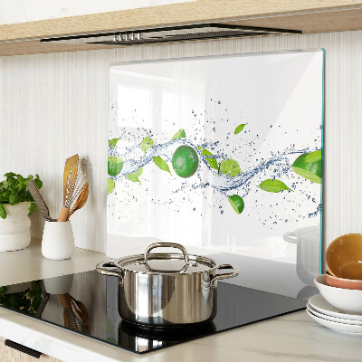 Glass kitchen board Lemons and water with leaves