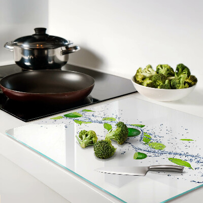 Glass kitchen board Lemons and water with leaves