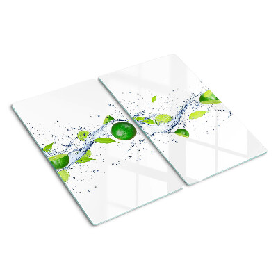 Glass kitchen board Lemons and water with leaves