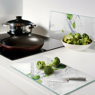 Glass kitchen board Lemons and water with leaves