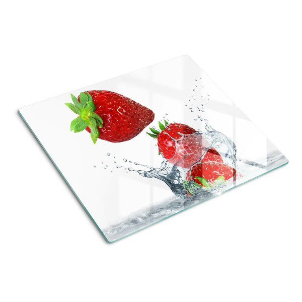 Glass chopping board Strawberries in water