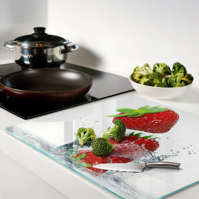 Glass chopping board Strawberries in water