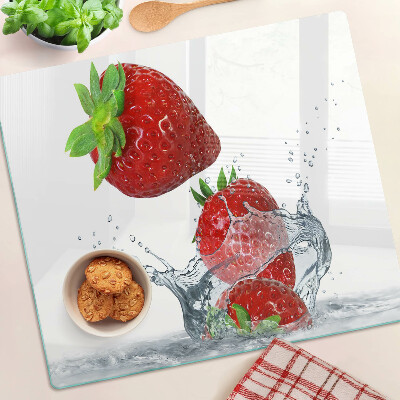 Glass chopping board Strawberries in water