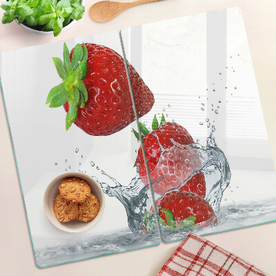 Glass chopping board Strawberries in water