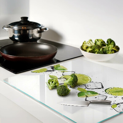 Glass kitchen board Lemons with ice in water